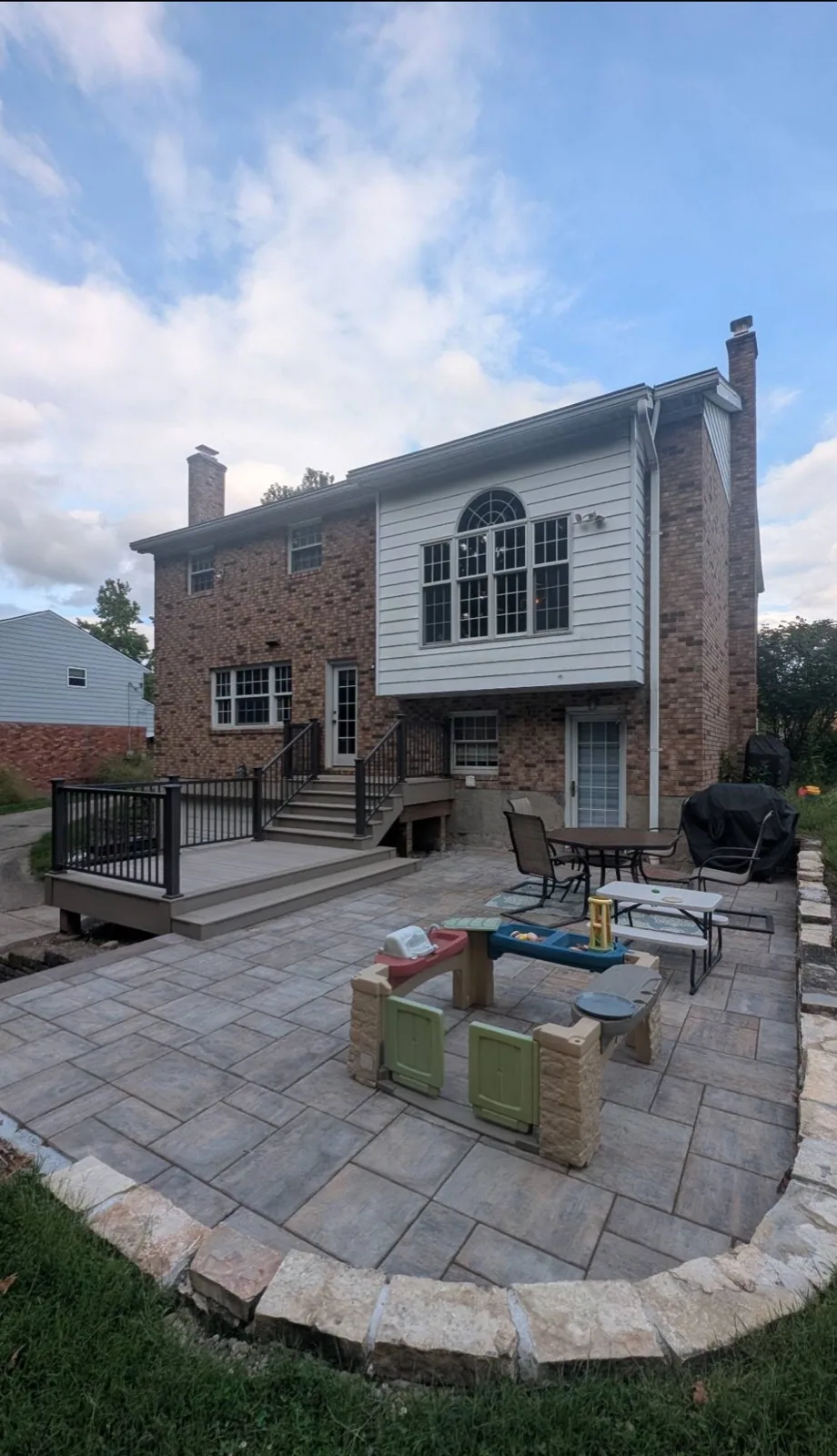 Deck and paver patio completed by Queen City Hardscapes