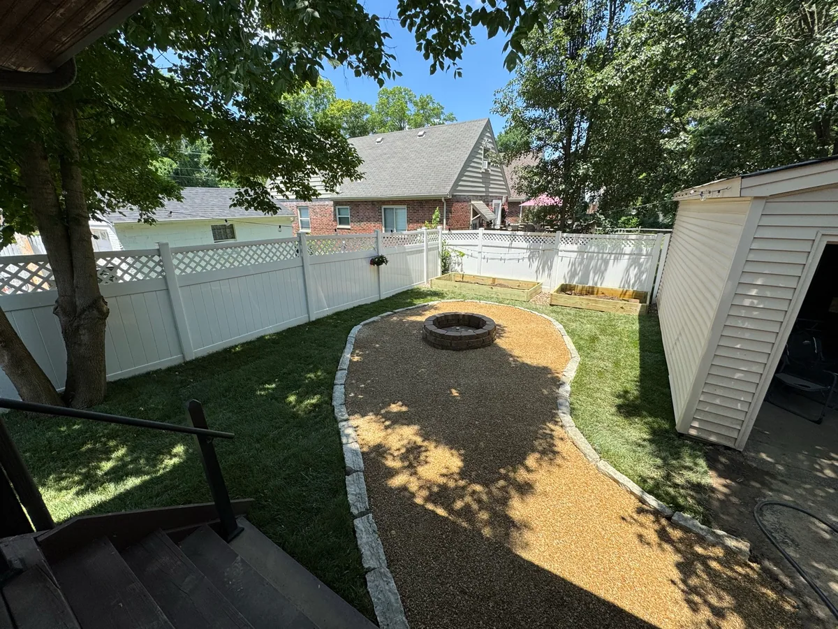 Fire-pit gravel garden completed by Queen City Hardscapes