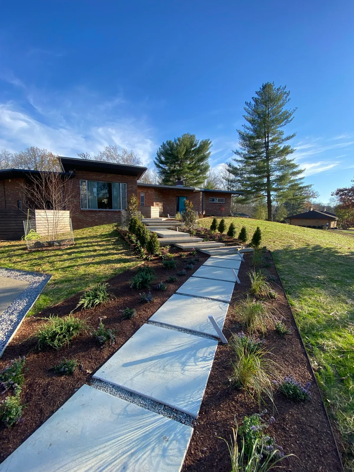 Front walkway and landscape completed by Queen City Hardscapes