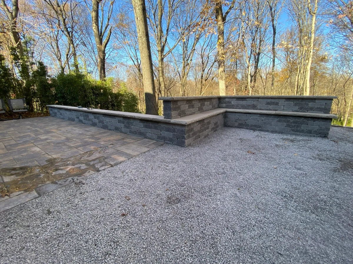 Patio seat wall completed by Queen City Hardscapes