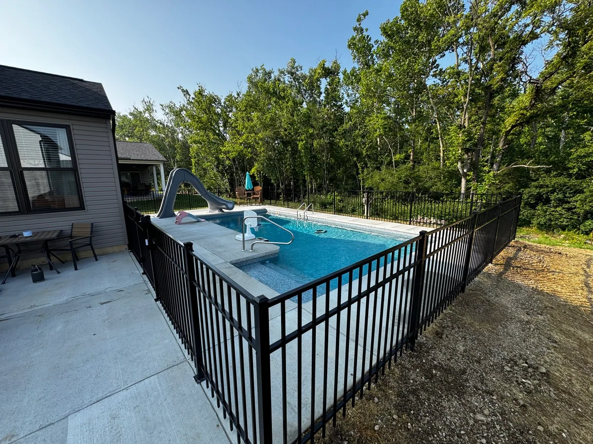 Fence around pool completed by Queen City Hardscapes